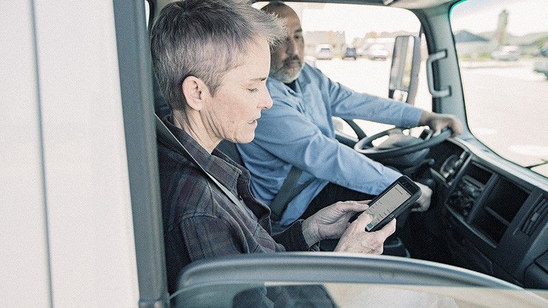 fleet drivers use mobile device in van cab