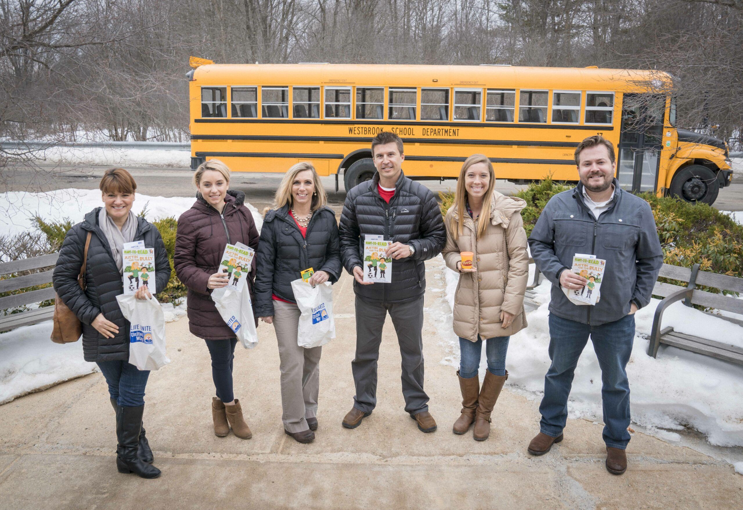 Volunteers delivering literacy kits