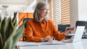 woman at work looking at a laptop