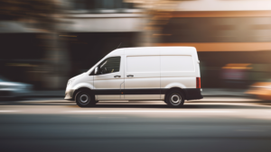 commercial vehicle van speeding along in a city scene