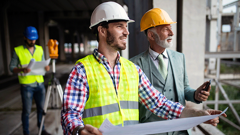 Construction workers discussing build plans