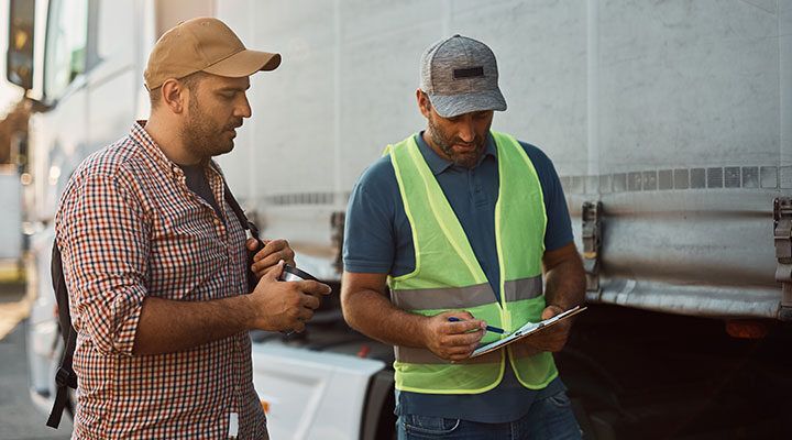 fleet manager talking with driver