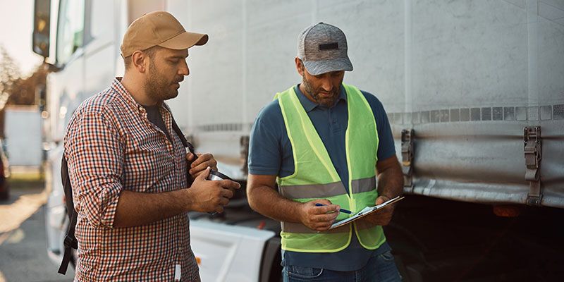 fleet manager talking with driver