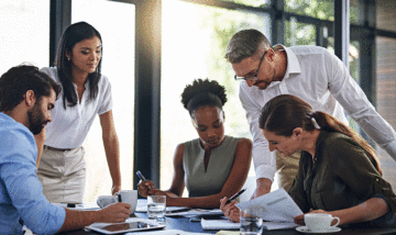 Team of business people working on their financial audit